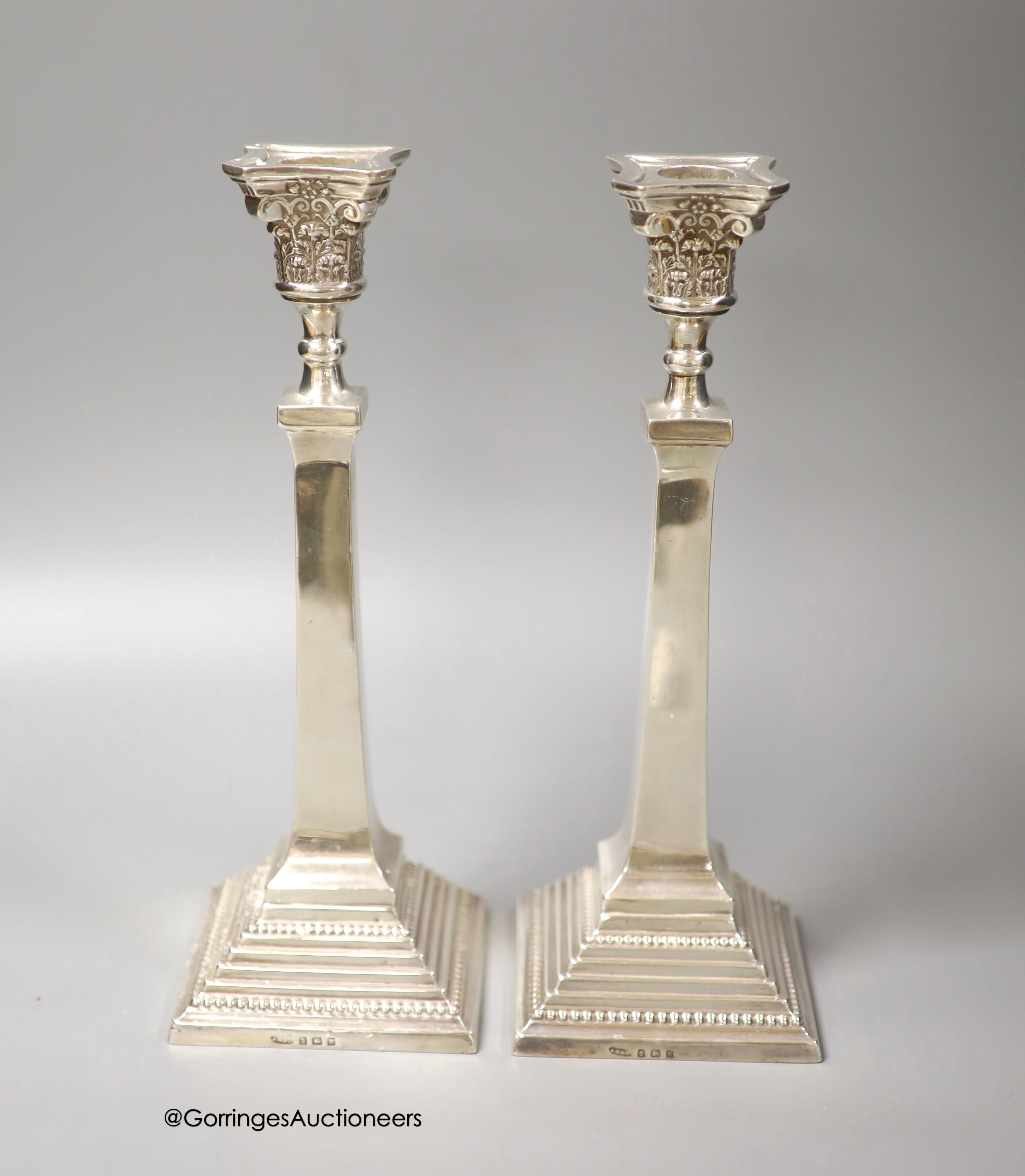 A pair of George V silver candlesticks, Britton, Gould & Co, Birmingham, 1934, 28.4cm, 20.5 oz, lacking sconces.